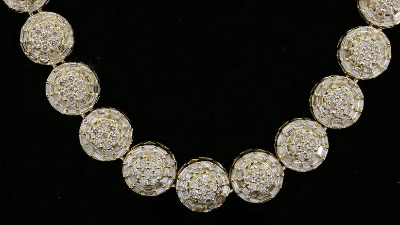 close up view of a luxury yellow gold plated necklace featuring circular diamond links 
