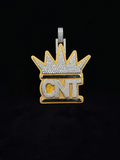 front view Hip hop style custom iced out crown pendant with CNT initials in yellow gold and diamonds.