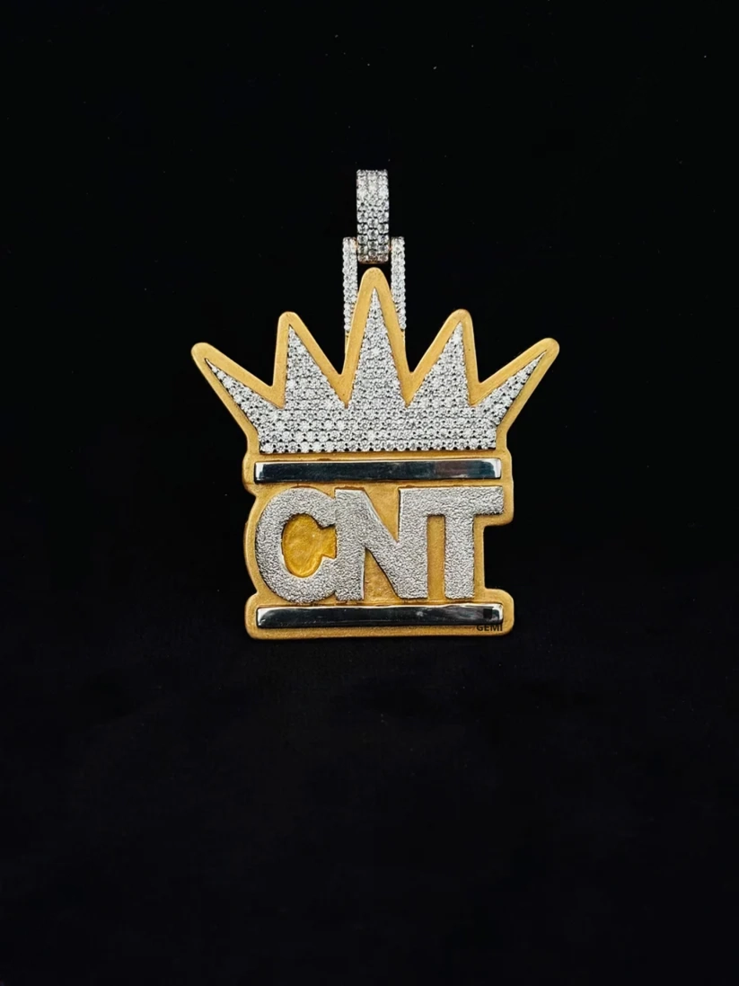 front view Hip hop style custom iced out crown pendant with CNT initials in yellow gold and diamonds.