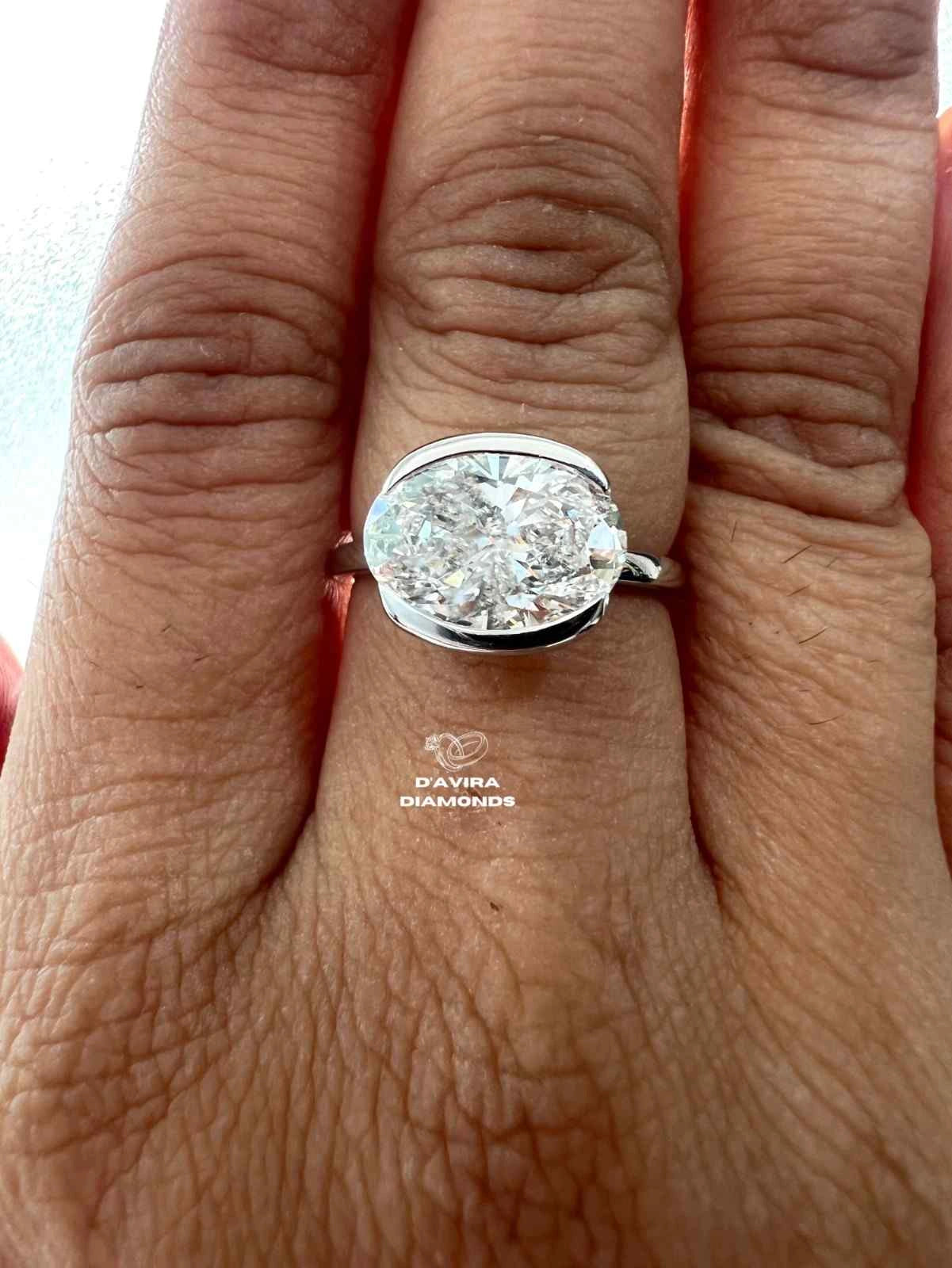East West Oval Cut Half Bezel Set Diamond Ring