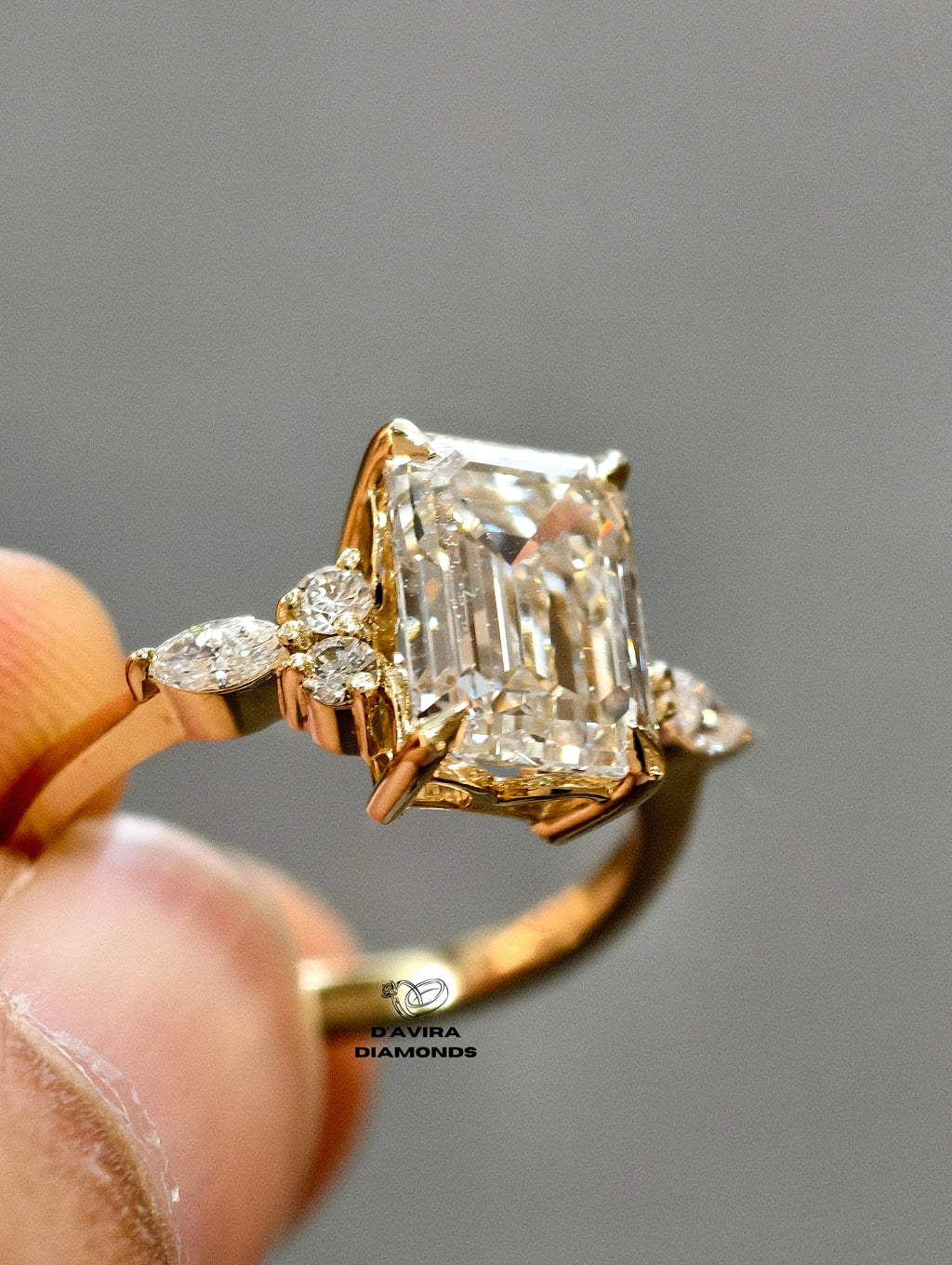 side accent band containing smaller round and marquise diamonds.