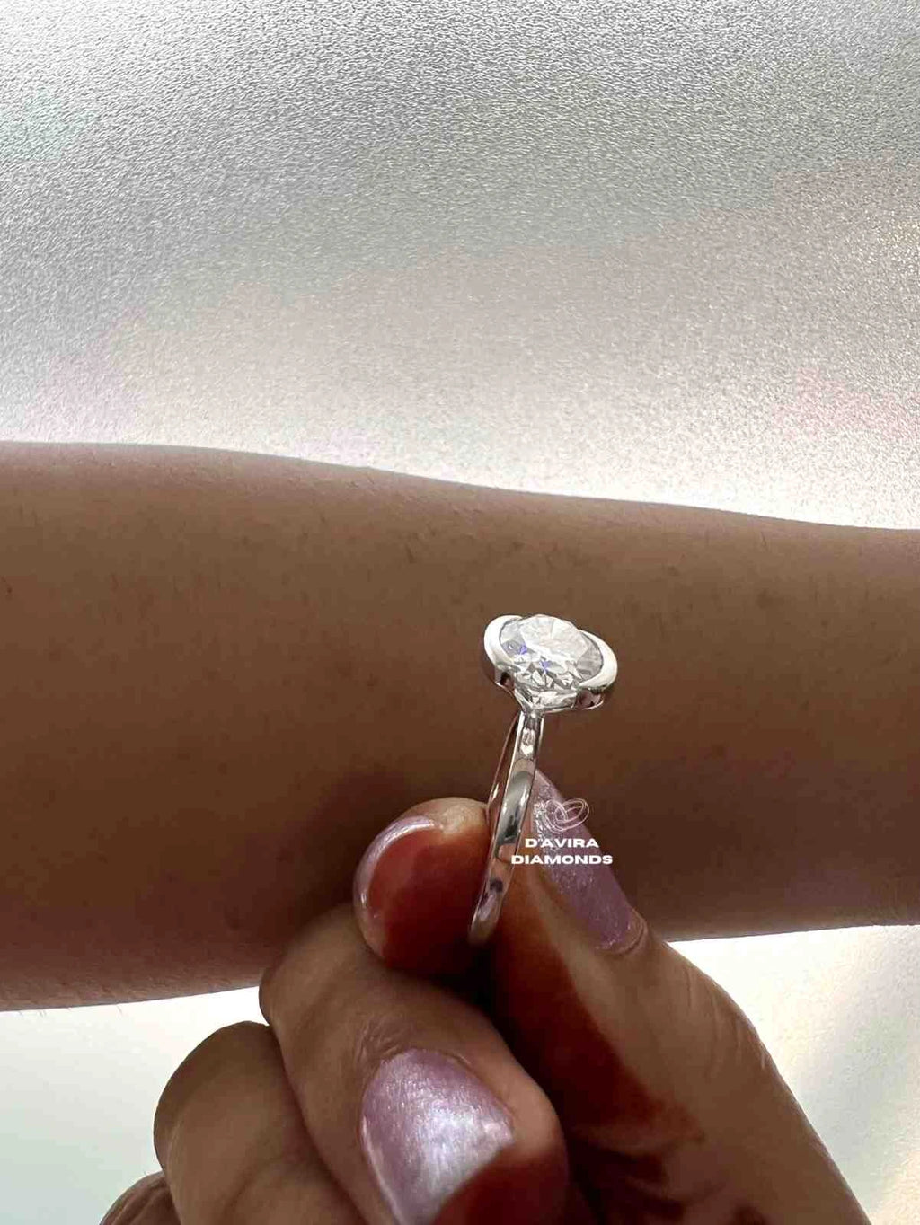 East West Oval Cut Half Bezel Set Diamond Ring