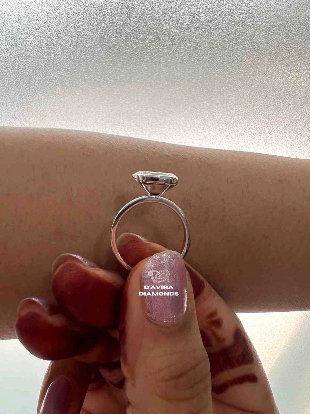 East West Oval Cut Half Bezel Set Diamond Ring