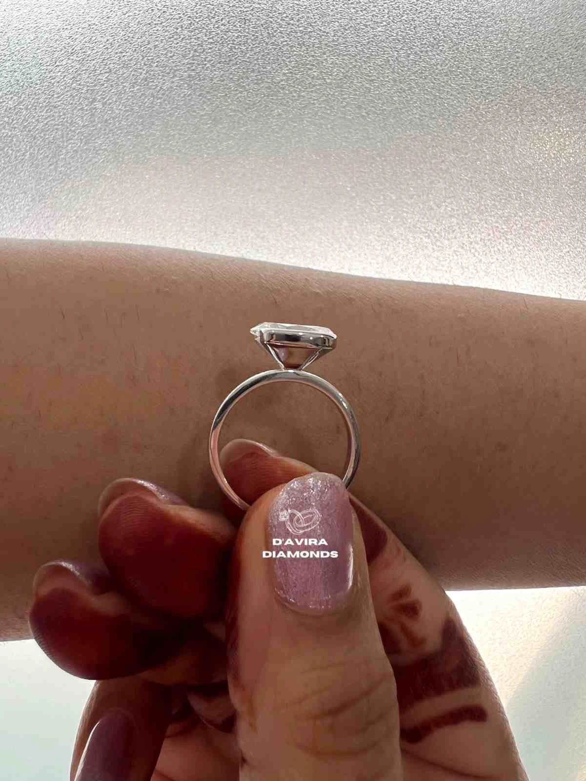 East West Oval Cut Half Bezel Set Diamond Ring