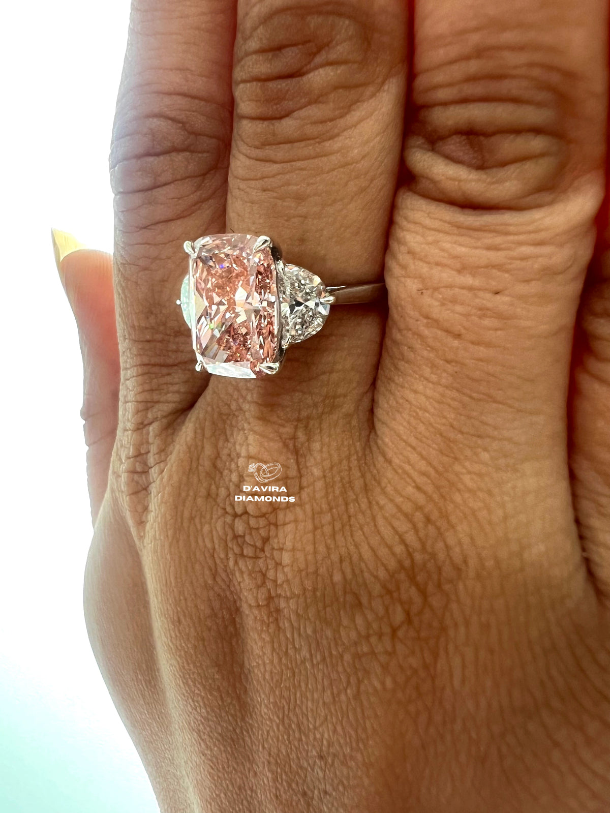 side view of the pink elongated cushion side stone half moon lab diamond ring