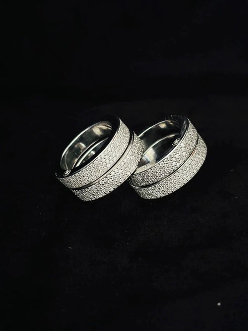 Silver multi-finger ring set with textured glitter finish pave diamond bands.