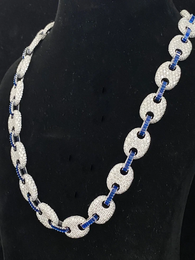 side view of the Iced out mariner link chain necklace with diamonds and blue sapphires