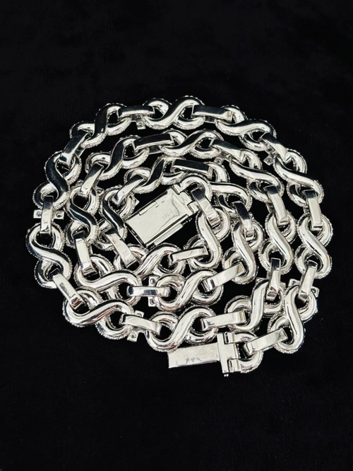 Heavy polished silver chain featuring interconnected S-shaped figure-eight links