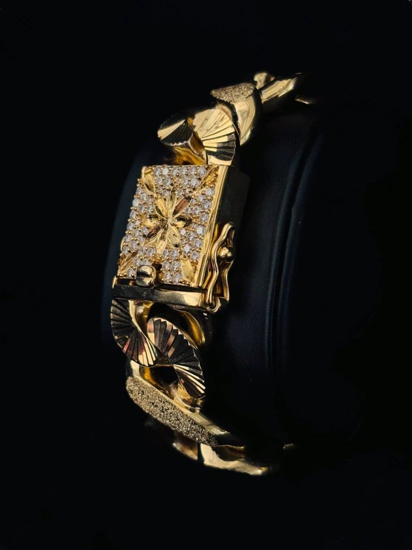 Close-up comparison of two heavy link bracelets textured oval links and detailed box clasp