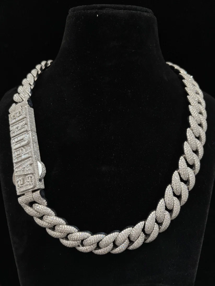Iced-out silver Cuban link necklace with custom CAPONE diamond name lock