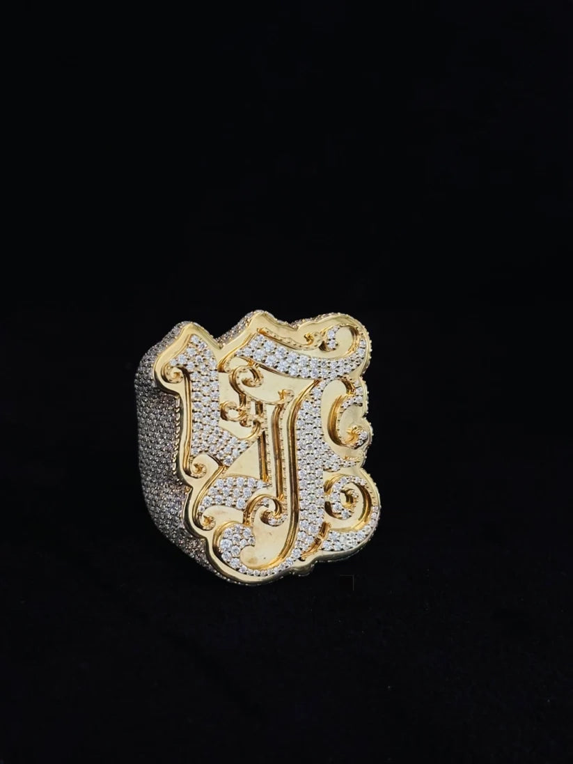 Large custom hip-hop monogram pinky ring in two-tone featuring heavy diamond pave setting