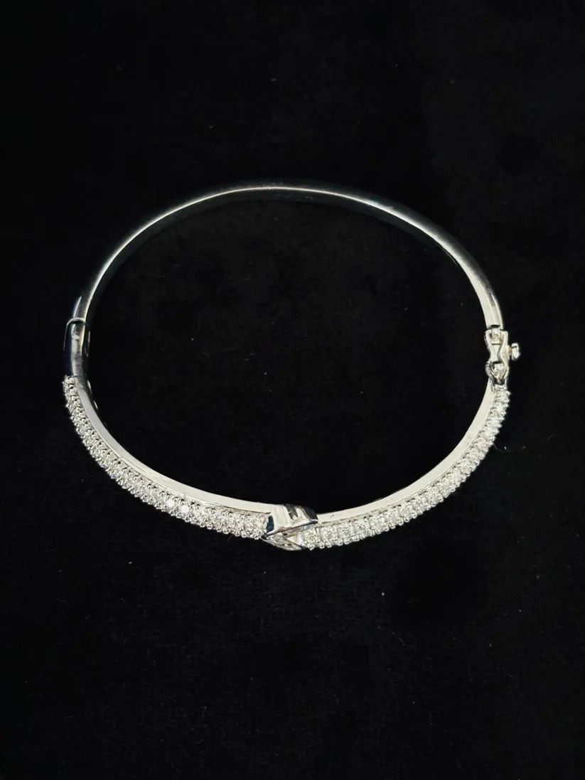 Sterling silver hinged bangle bracelet with pave diamond accents