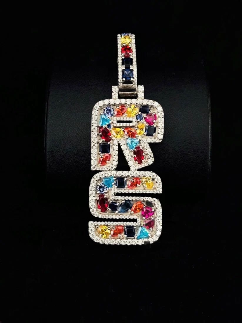 front view Blinged-out RS alphabet letter necklace piece with vibrant mixed-cut stones