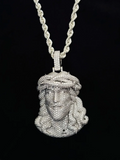 front view Iced out diamond Jesus piece pendant on a silver rope chain.