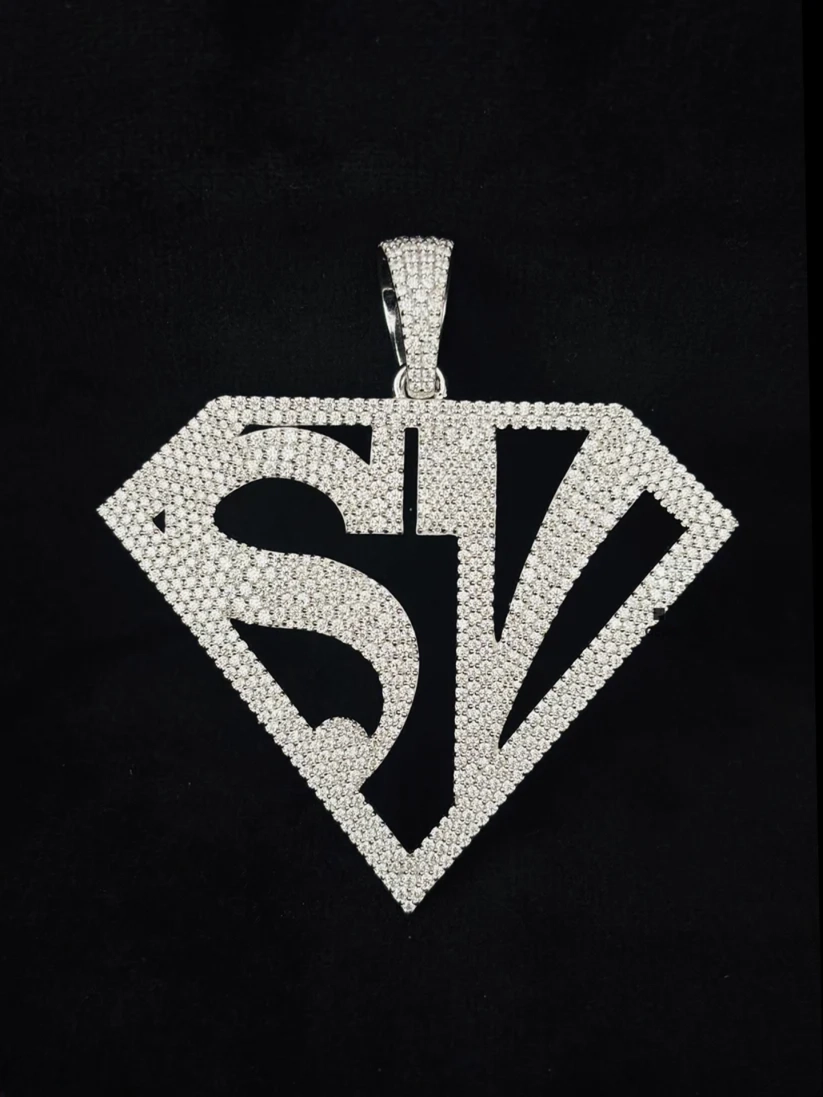 front view Iced out diamond SV pendant in a Superman shield frame