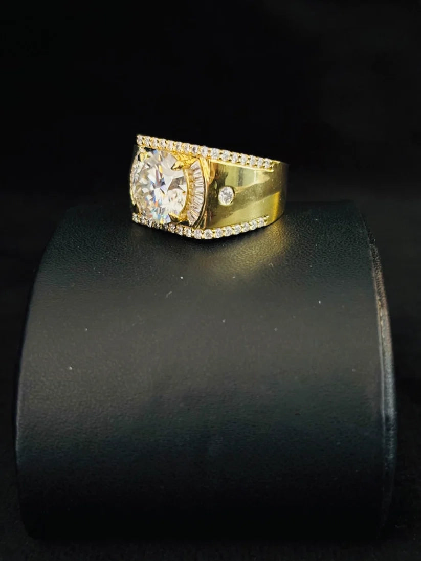 A side view gold plated ring with a large round-cut center stone and a halo of small pave-set stones