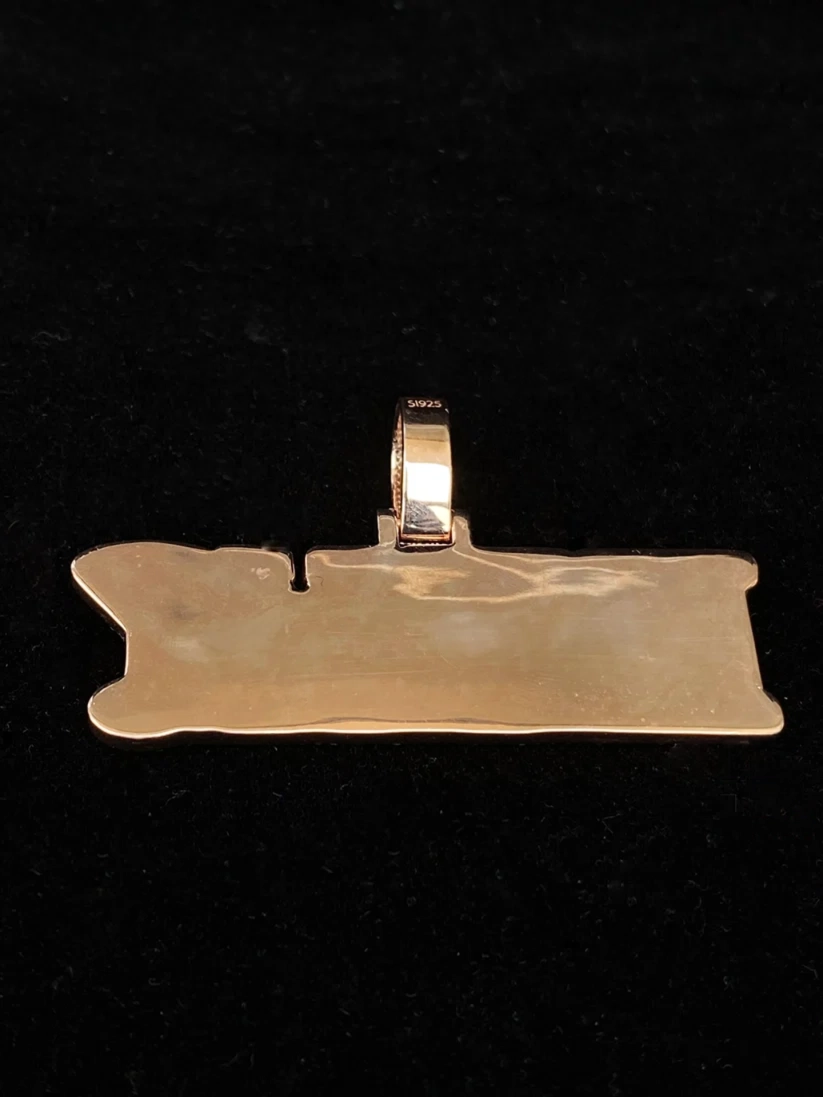 Gold horizontal rectangular pendant with a polished finish and thick bail.
