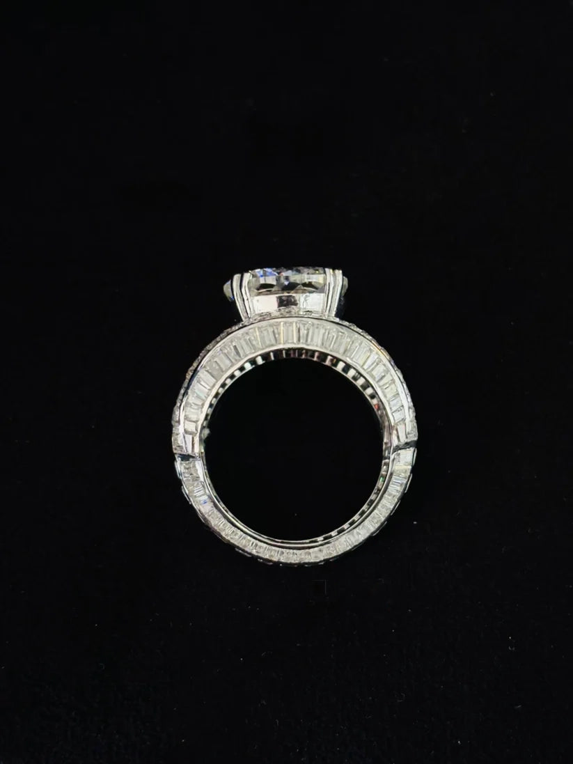 Close-up profile view of a luxury iced-out diamond wedding band with a massive center stone