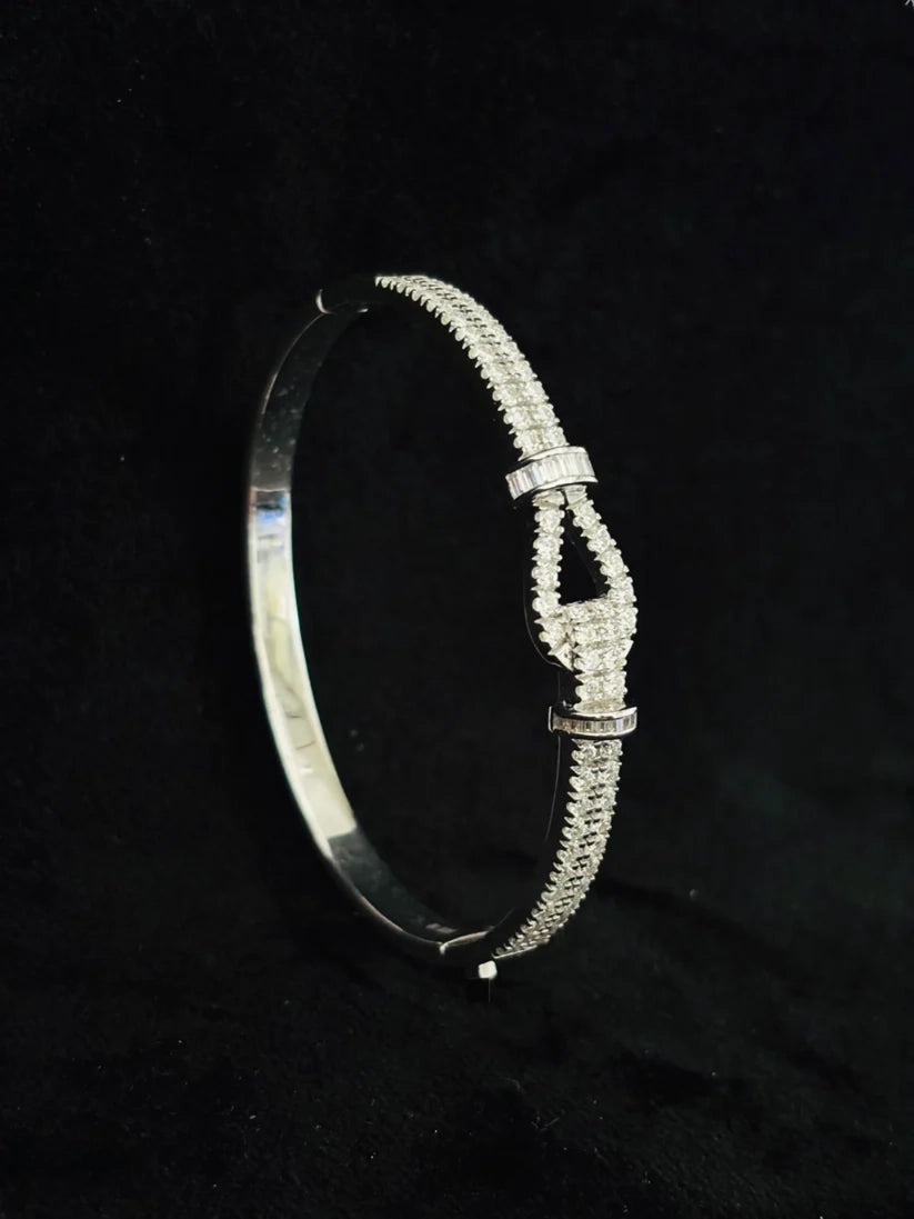 Elegant diamond-encrusted buckle bracelet with a double row band against a black background