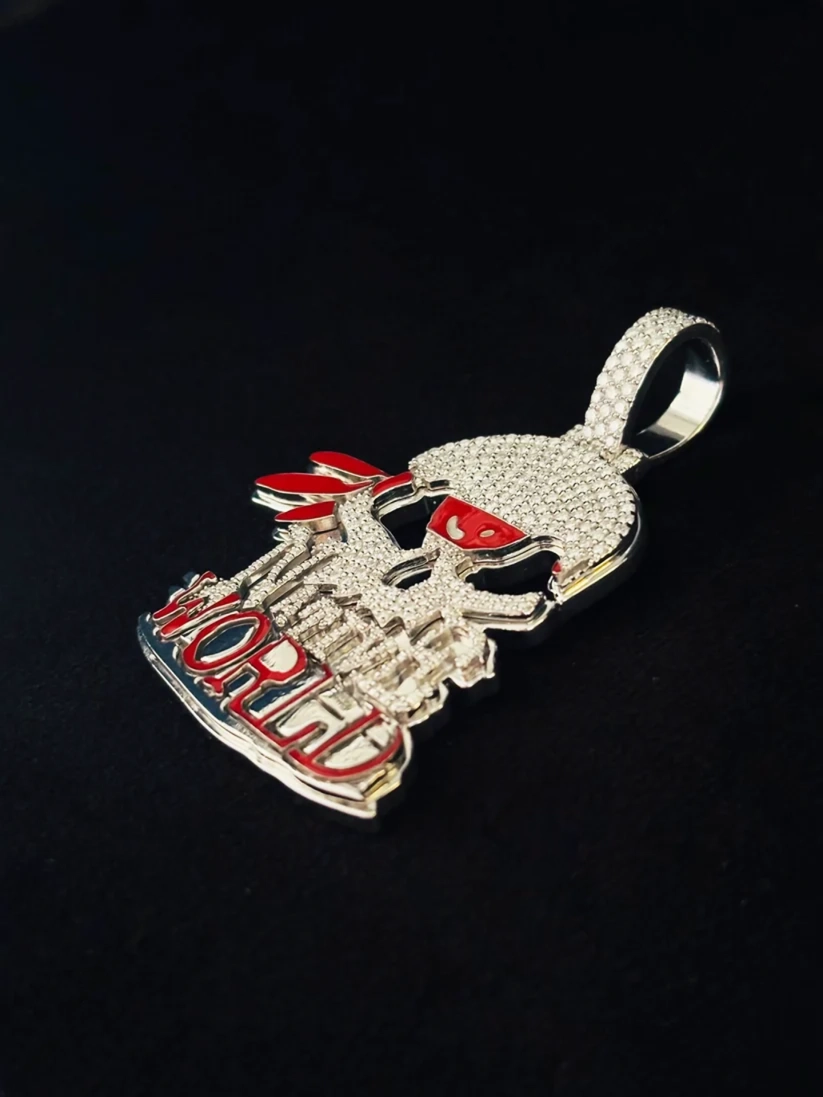 Iced out skull pendant charm in white gold with red accents.