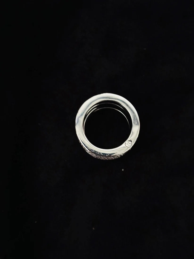 Polished sterling silver multi band ring for women on a black background