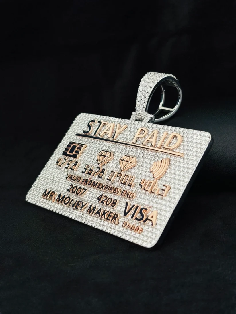 side view Diamond-encrusted credit card pendant necklace in white and rose gold with Stay Paid inscription.