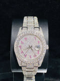 front view of the Diamond pave luxury watch with pink Arabic numerals 