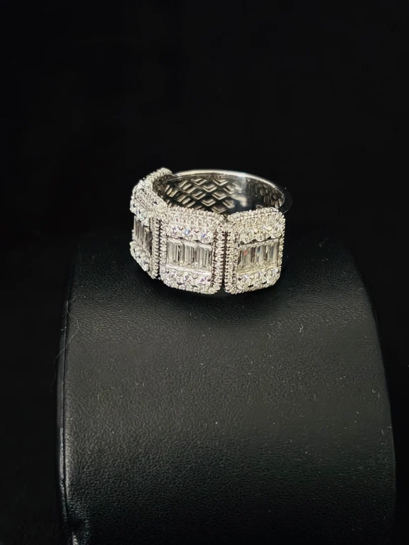 A front view Wide diamond baguette eternity band ring in with pave halo borders