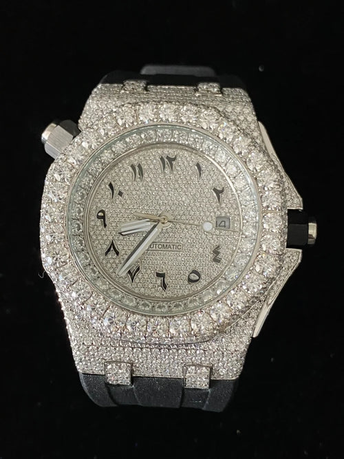 Custom diamond-encrusted luxury watch with Arabic dial numerals and black rubber strap