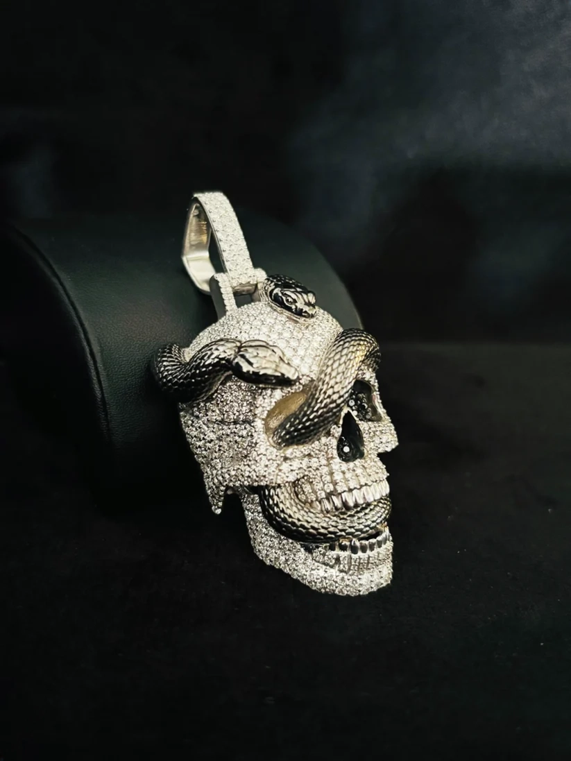 Iced out moissanite diamond skull and snake pendant in 925 sterling silver.