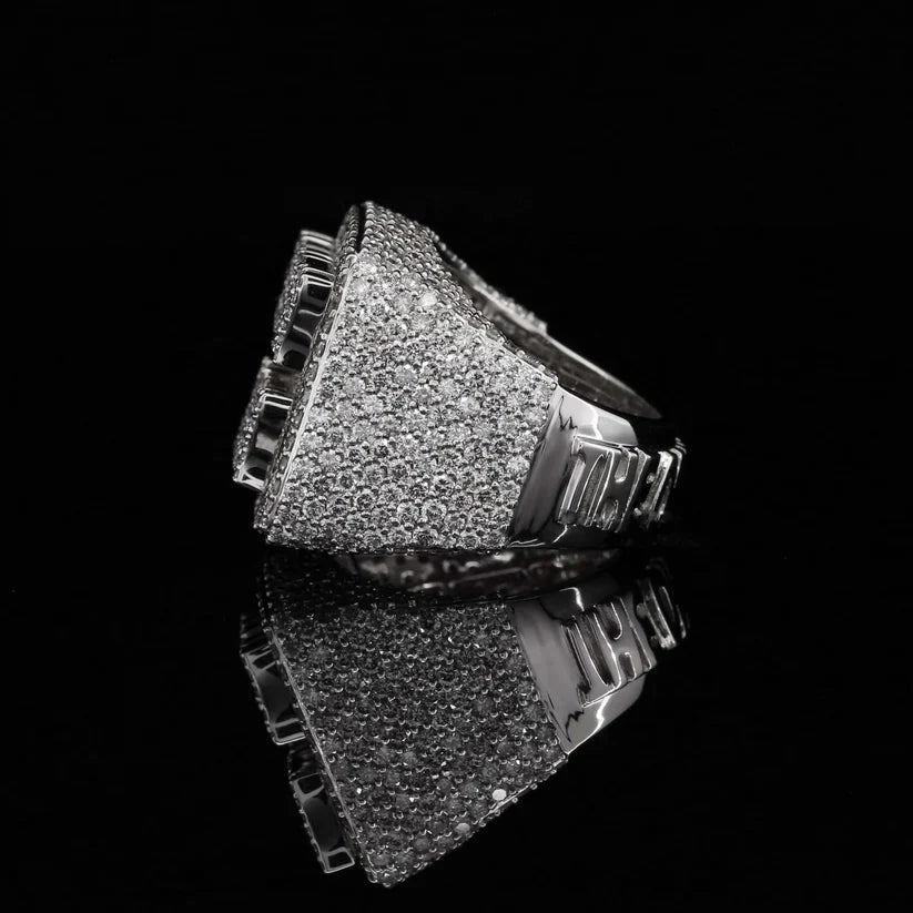 Side profile of a thick white gold men's signet ring fully iced out with pave diamonds