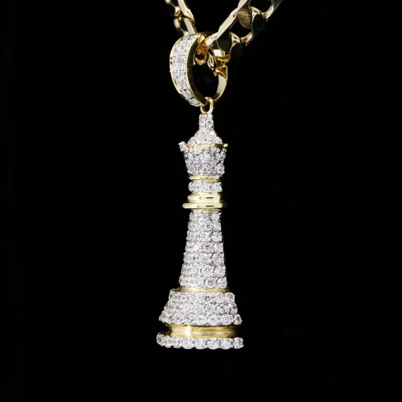 front view Gold and iced out diamond chess queen pendant necklace on a black background