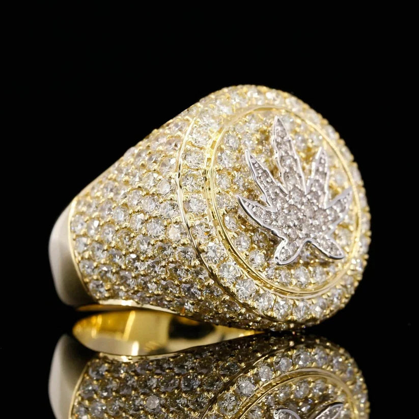 side view of the Men's gold iced out signet ring featuring a diamond cannabis leaf motif