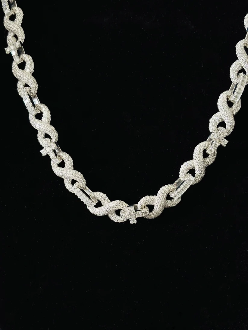 Iced out silver infinity loop chain necklace covered in pave diamonds
