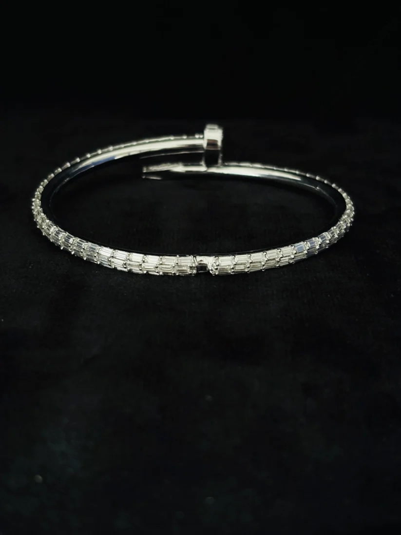 A back view Luxury baguette diamond nail bangle bracelet in silver 