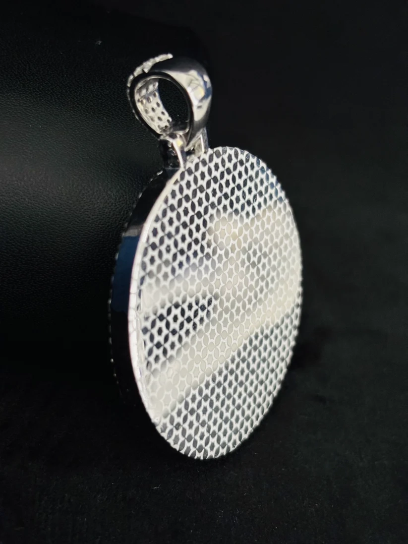 Back view of a sterling silver iced-out custom picture pendant showing the honeycomb mesh grill and diamond-encrusted bail.