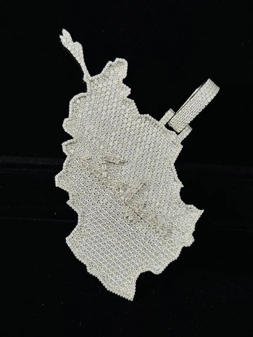 Iced out map pendant necklace charm in sterling silver with pavé moissanite stones