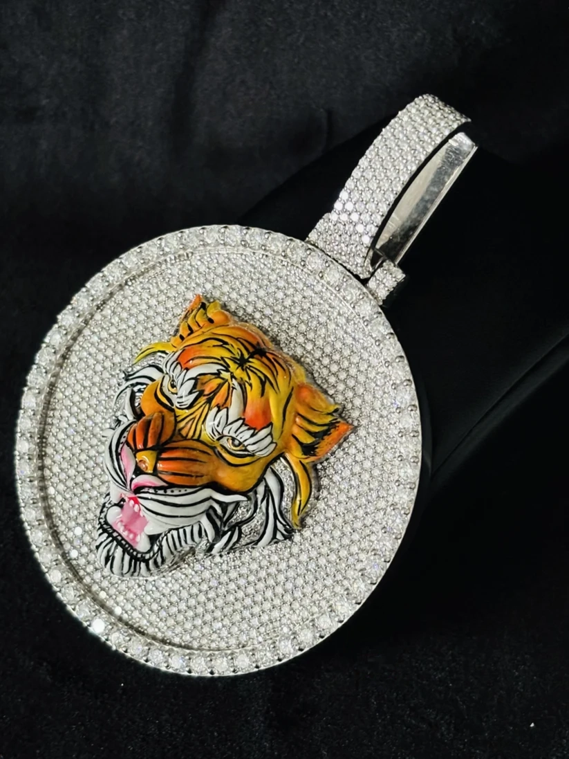 Pave diamond tiger pendant necklace with enamel details.