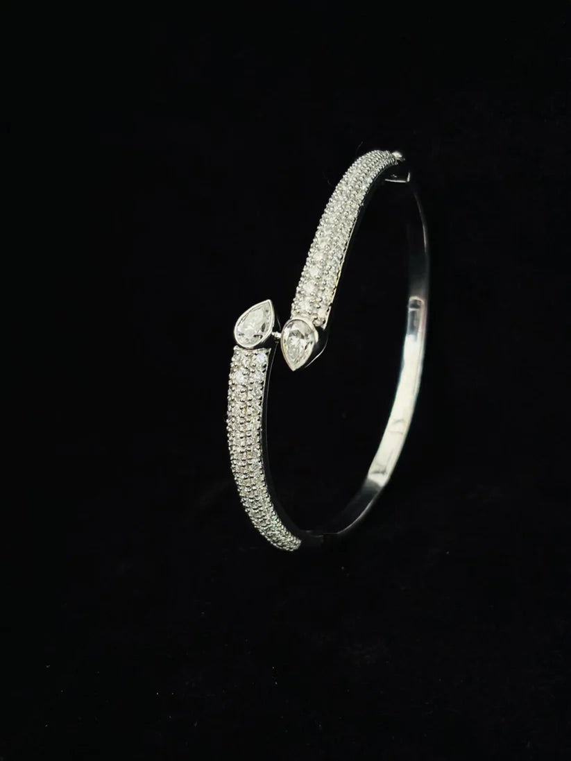 A top view Silver Moissanite bracelet with pear shaped teardrop stones
