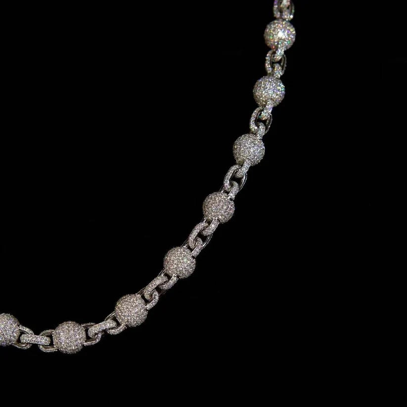 close up of a Iced out paved diamond bead link chain jewelryv
