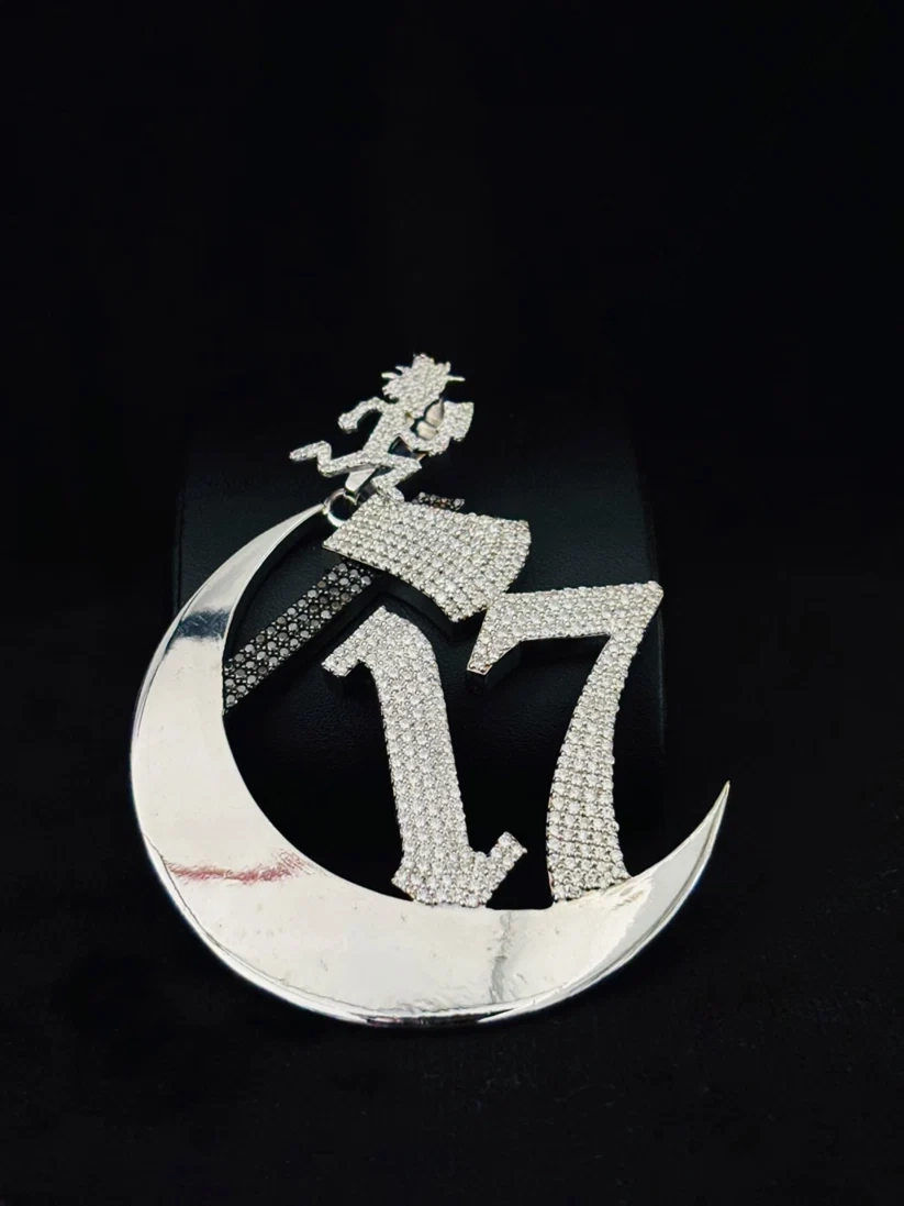 front view iced out with moissanite diamonds, featuring the ICP Hatchetman axe symbol.