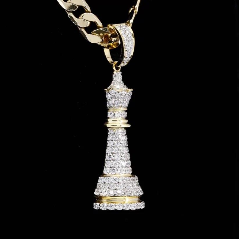 Gold and diamond iced out chess king piece pendant necklace on a curb chain