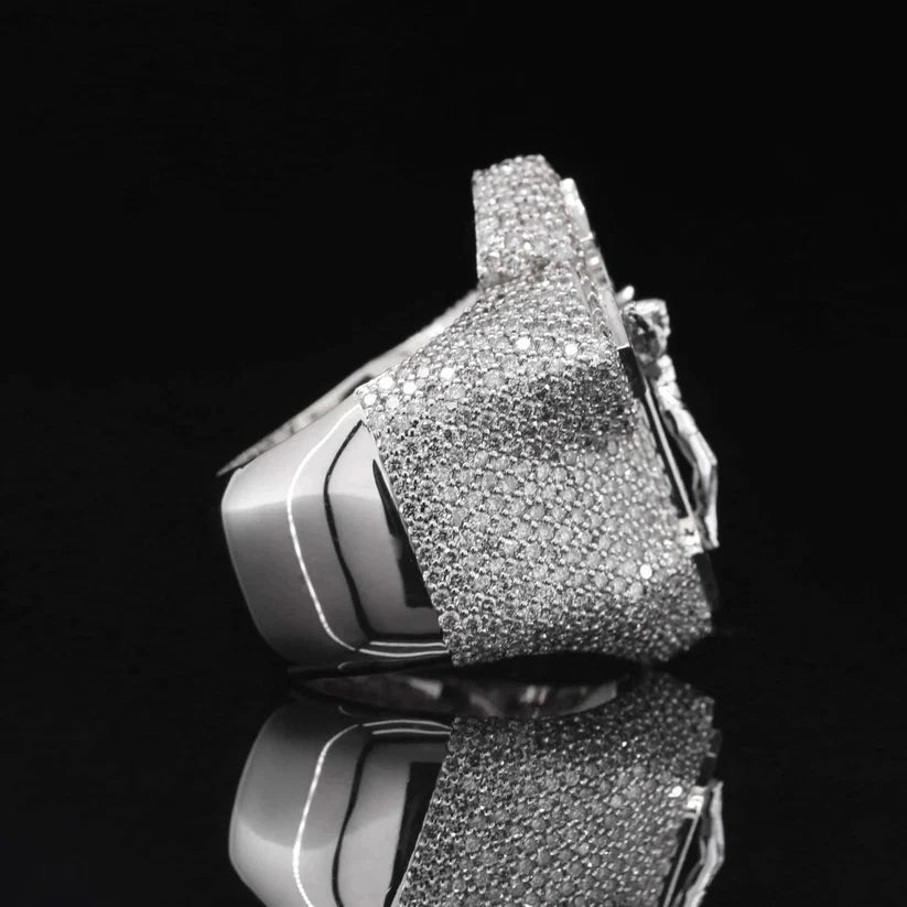 Side view of a chunky sterling silver men's signet ring heavily paved with cubic zirconia diamonds