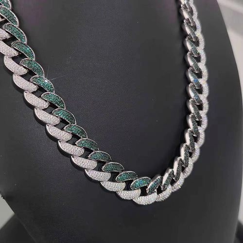 Silver Miami Cuban link chain necklace paved with white diamonds and green emeralds