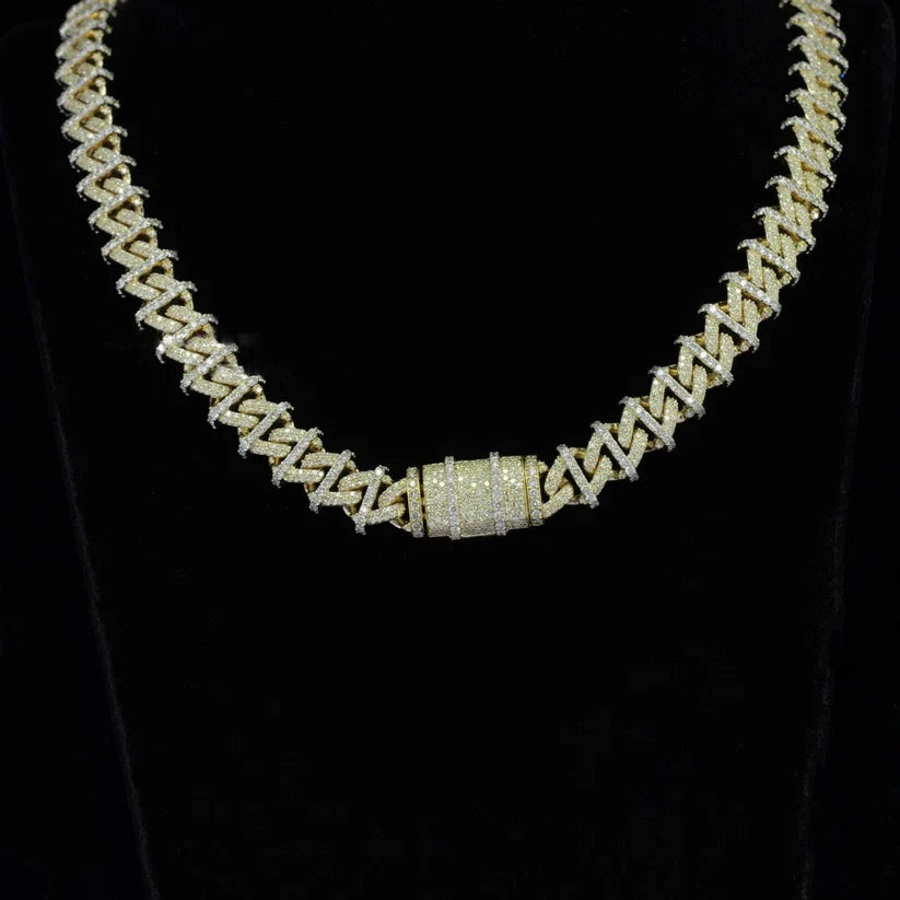 close up of a Iced out gold spiked Cuban link chain necklace with a diamond lock clasp