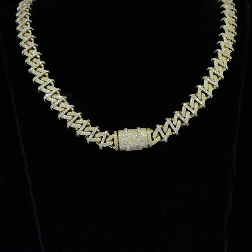 close up of a Iced out gold spiked Cuban link chain necklace with a diamond lock clasp