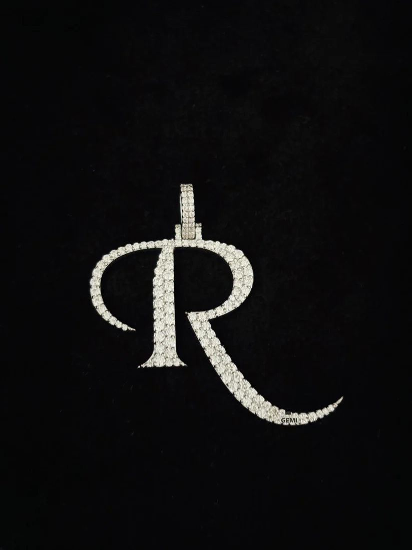 front view  Iced out cursive letter R diamond pendant charm in white gold.