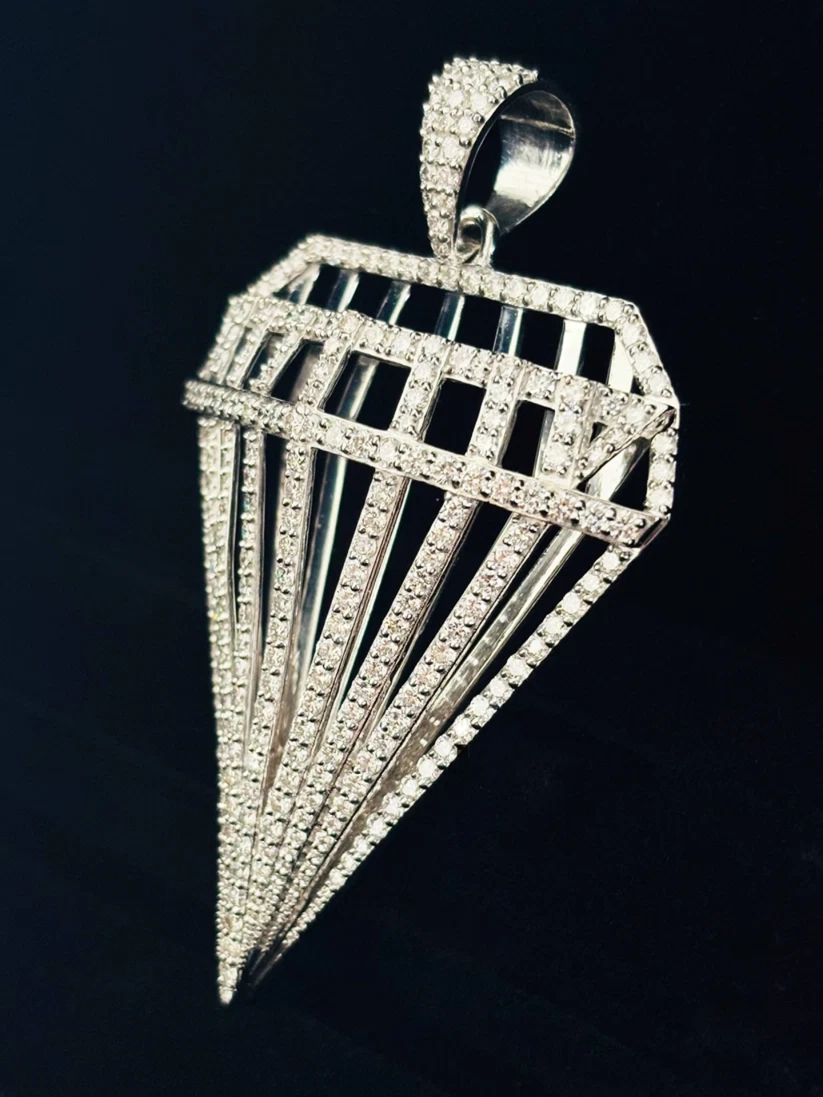 3D diamond cage pendant in sterling silver iced out with VVS moissanite stones.