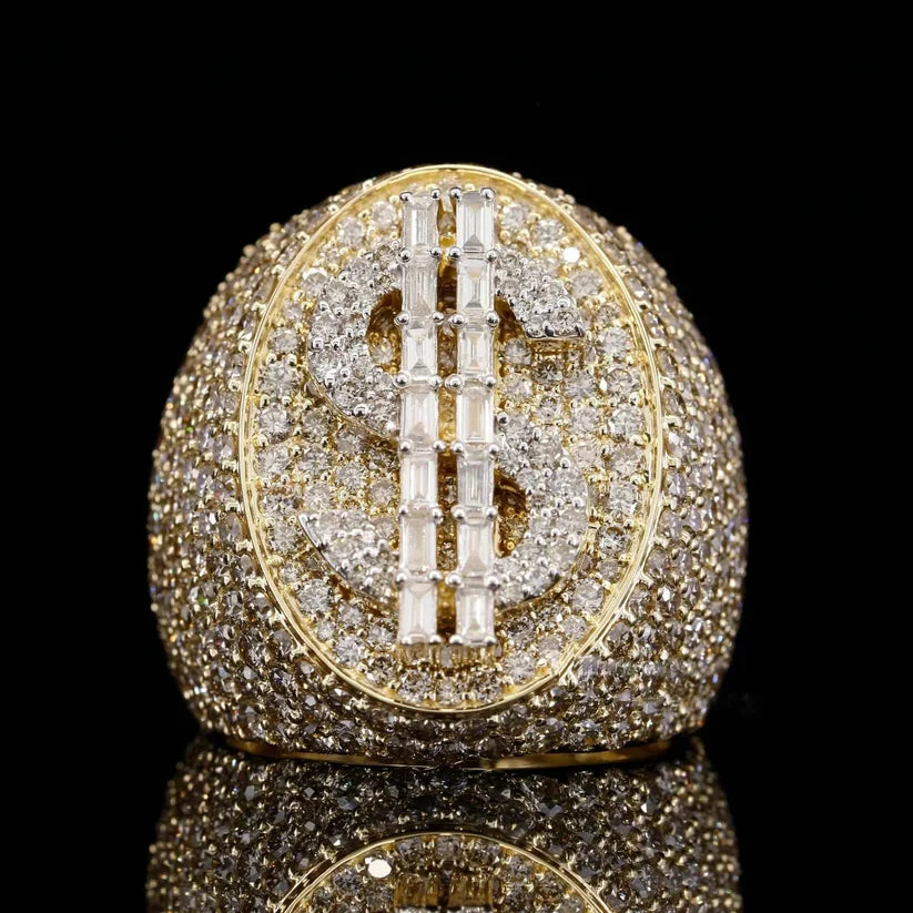 front view of the dollar sign ring encrusted with round and baguette diamonds
