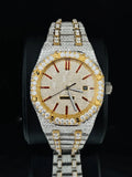Iced-out AP Royal Oak style diamond watch in two-tone gold and silver with red ruby hour markers.
